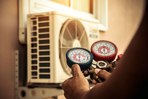 Professional Air Conditioning Service technician working in Helm, CA